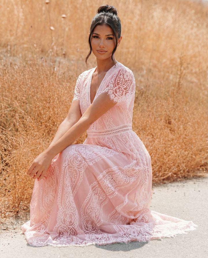Full length view of the formal lace maxi dress styled for parties