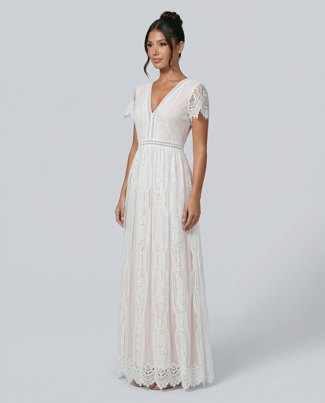Side profile view of the floor-length lace maxi dress highlighting the fitted bodice and delicate lacework.