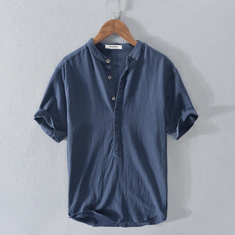 Dark blue short sleeve men's shirt displayed on a hanger