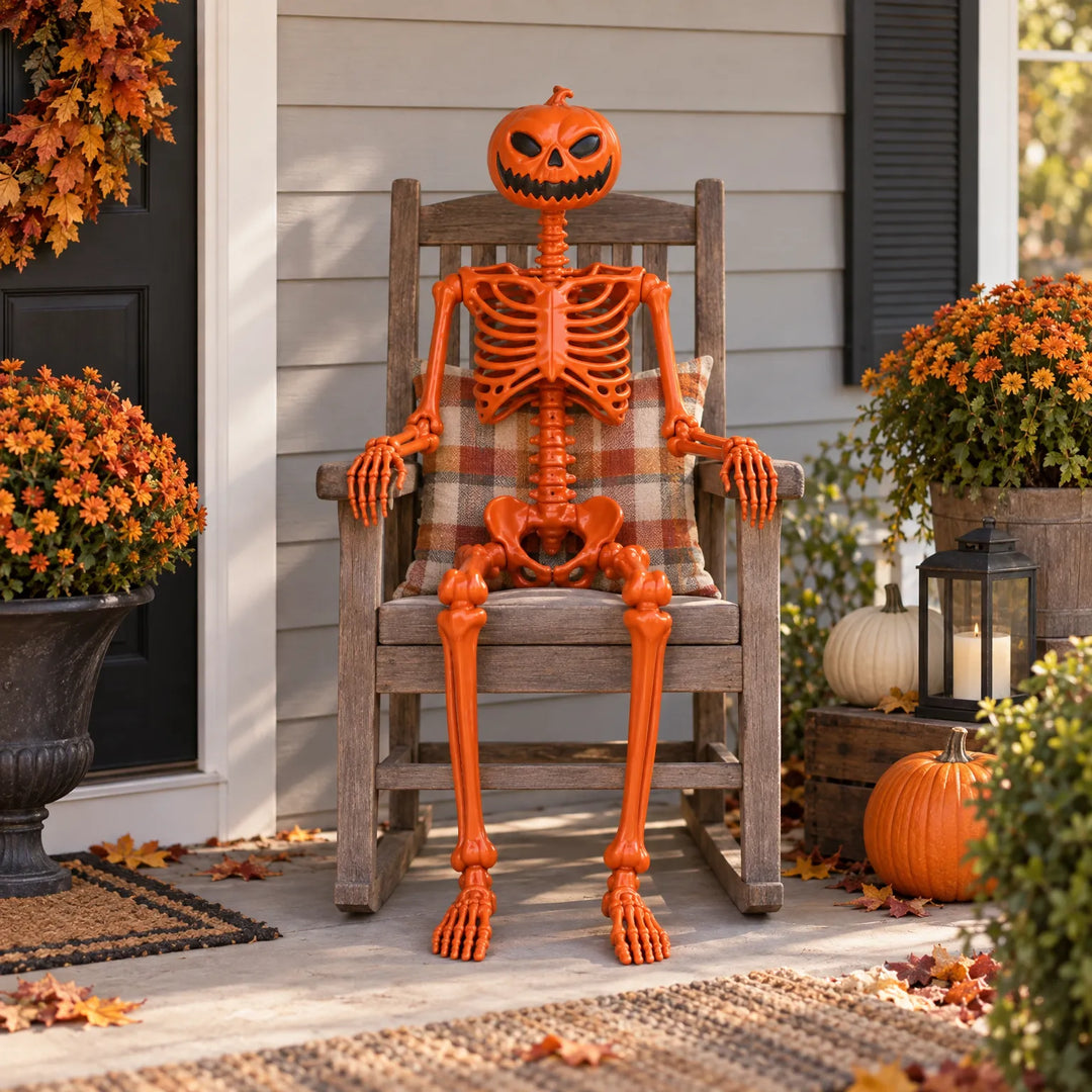 Orange Halloween skeleton prop sitting on a wooden porch rocking chair