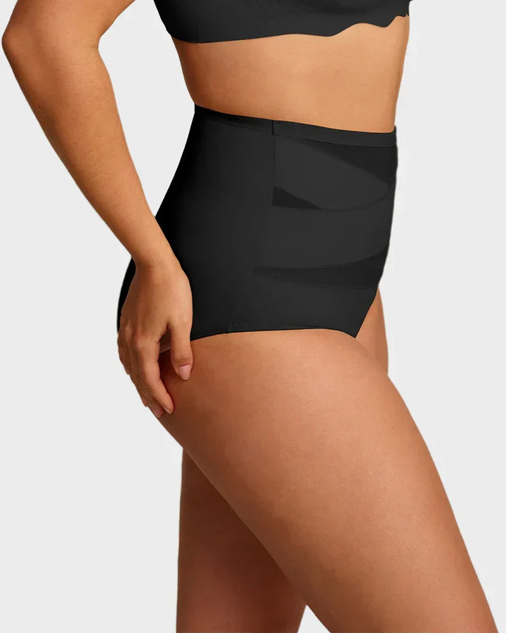 Cross tummy control panties laid out flat showing front crossover design