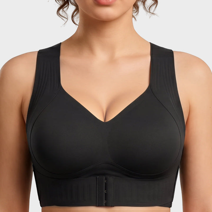 Woman wearing black posture support sports bra showing fit