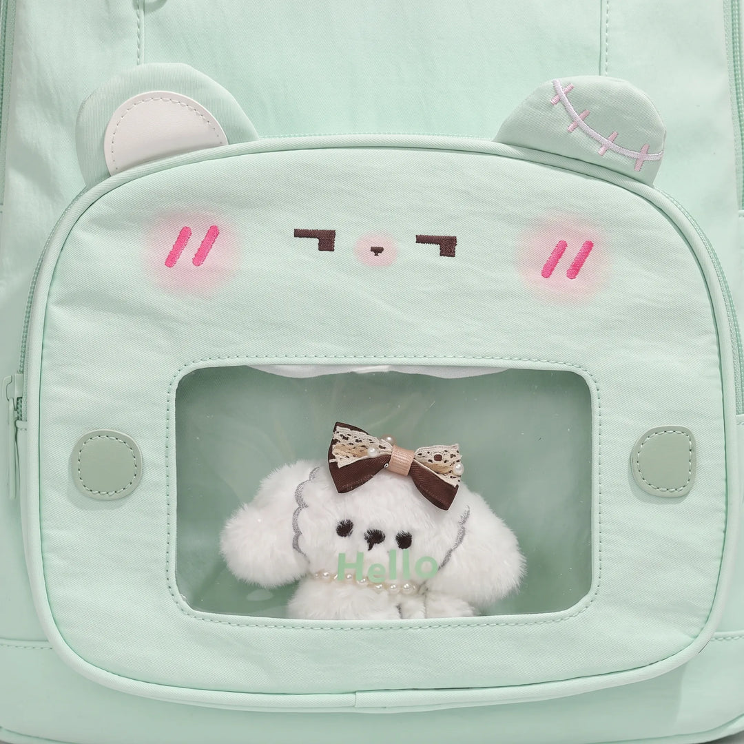 Detailed view of the padded shoulder straps and durable top handle on the women's daypack