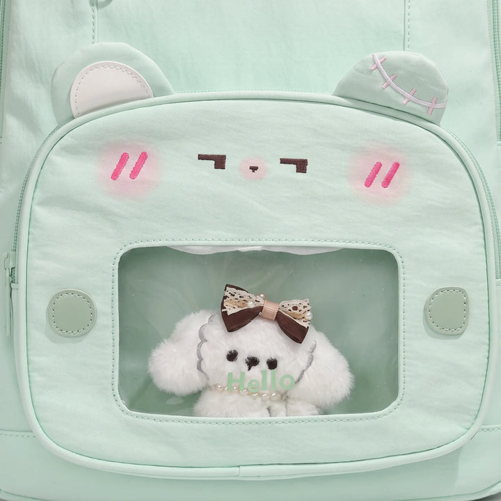 Detailed view of the padded shoulder straps and durable top handle on the women's daypack