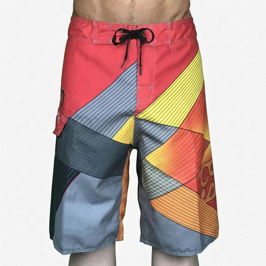 Flat lay of colorful printed beach shorts styled for tropical summer vacations