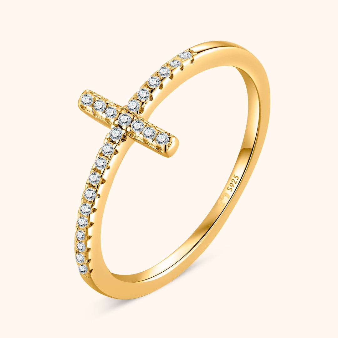Close up of silver cross ring with sparkling zirconia stones