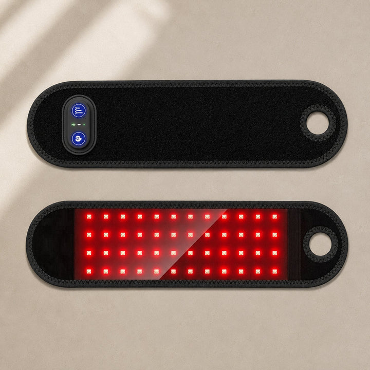 Top view of the black wrist wrap showing control buttons and red LEDs