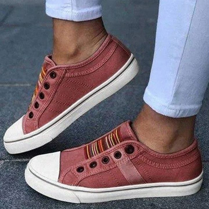 Side angle of casual slip-on trainers showing non-slip rubber soles