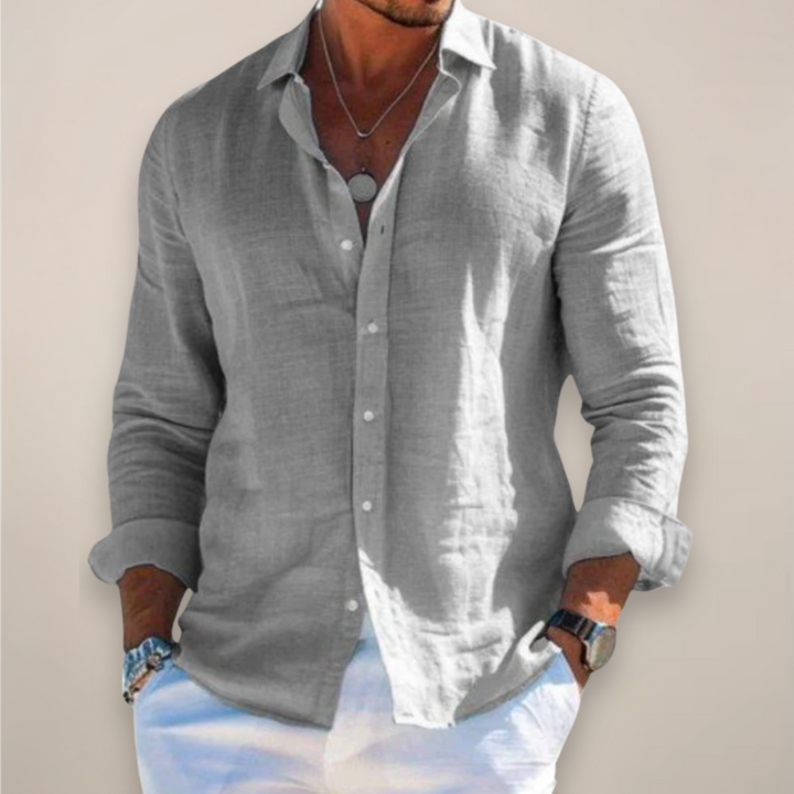 Man wearing a grey long sleeve button-down shirt with a relaxed fit