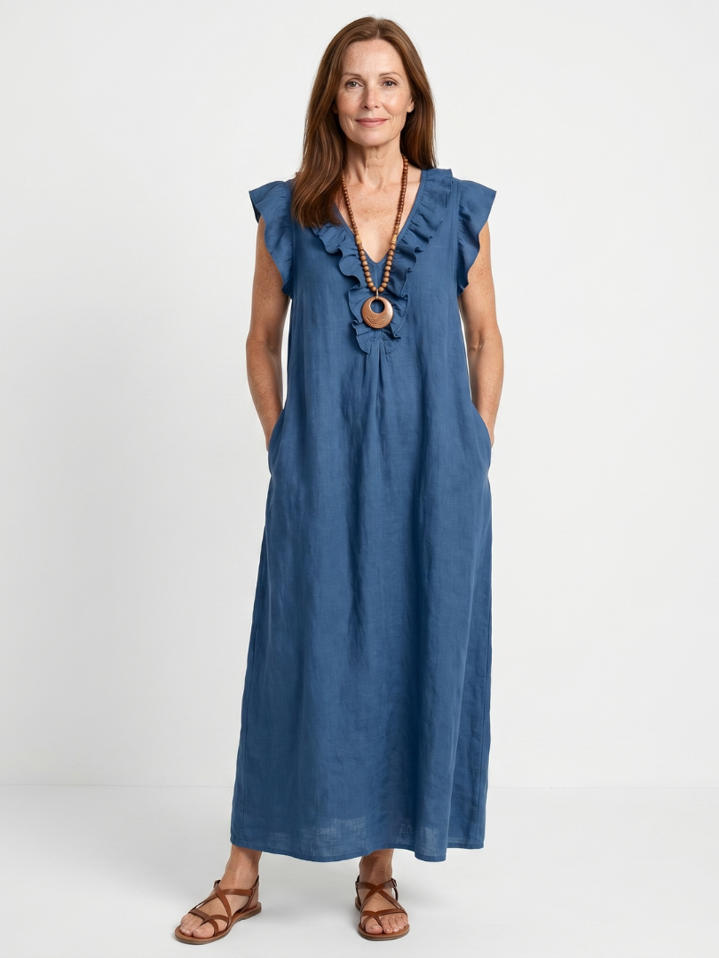 Model standing in blue sleeveless V-neck midi summer dress with ruffles