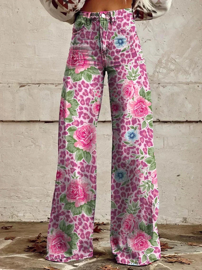 Women wearing vibrant pink floral and leopard print wide leg trousers