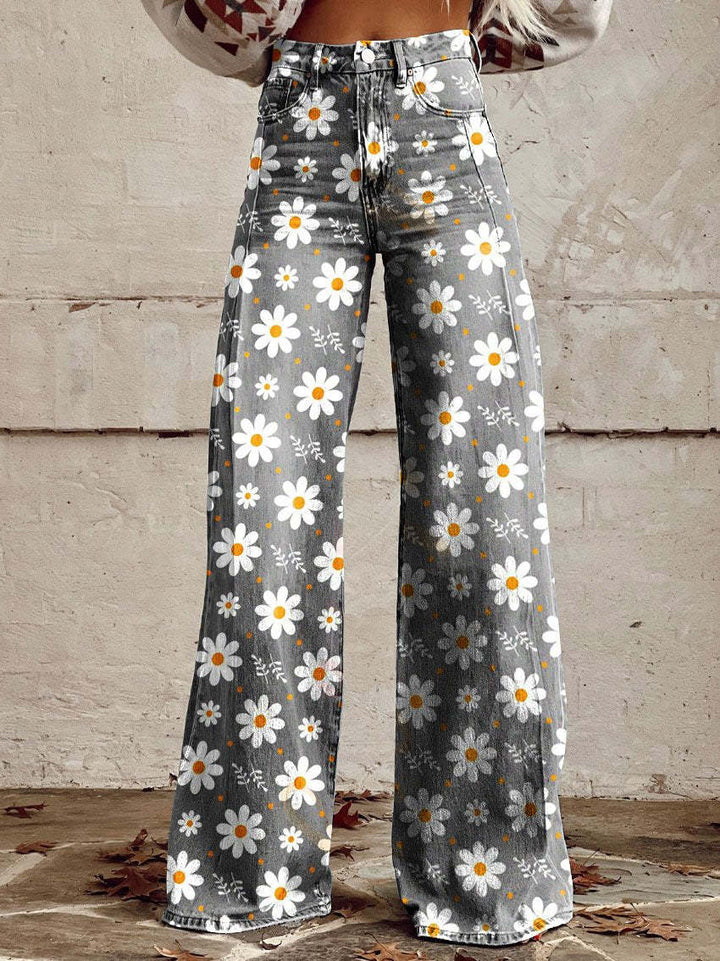 Women wearing high waist wide leg trousers with white daisy print
