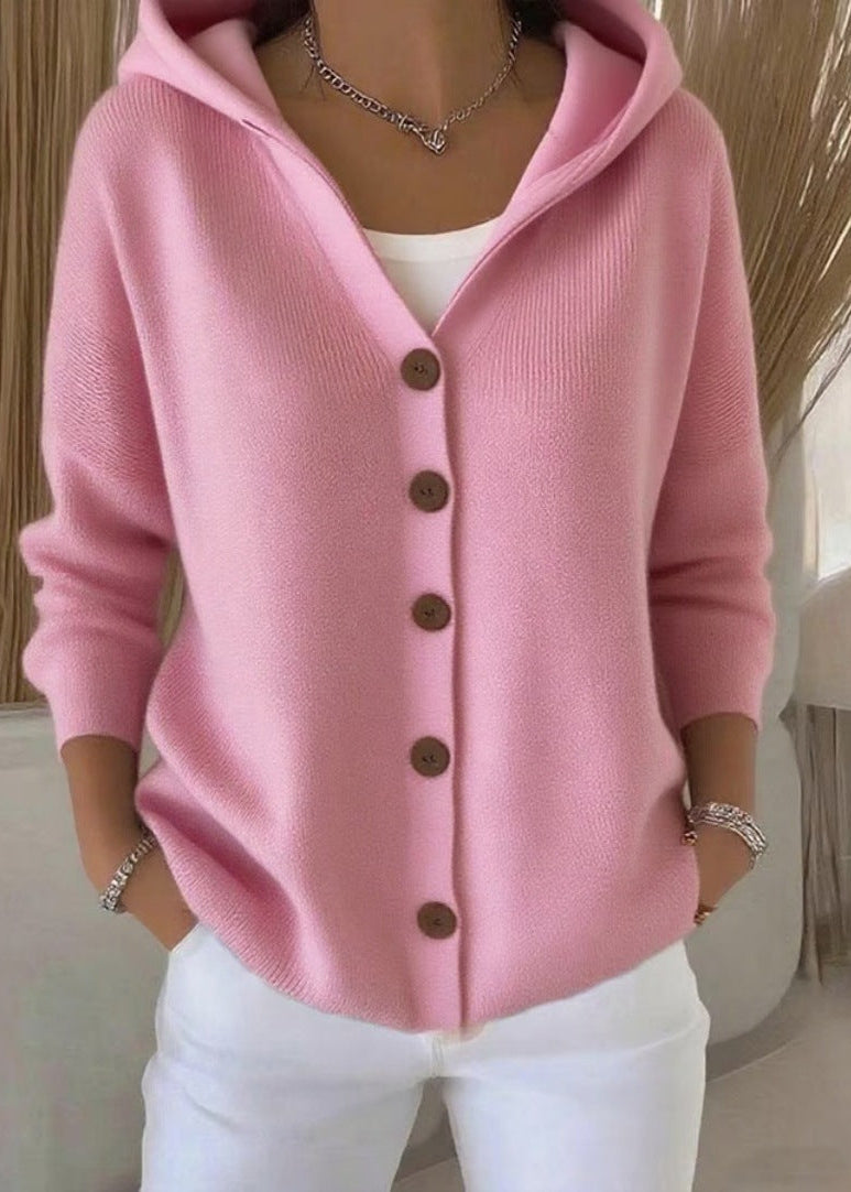 Close-up of the pink hooded button knit cardigan showing the button closure and knit texture.