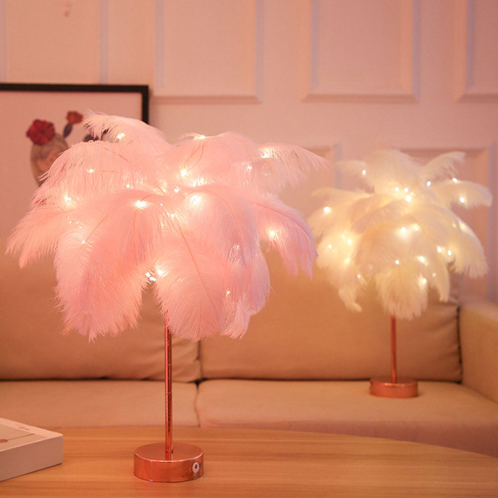 Pink and white feather table lamps displayed in a cozy living room