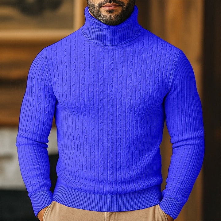 Man wearing a vibrant blue cable-knit turtleneck jumper