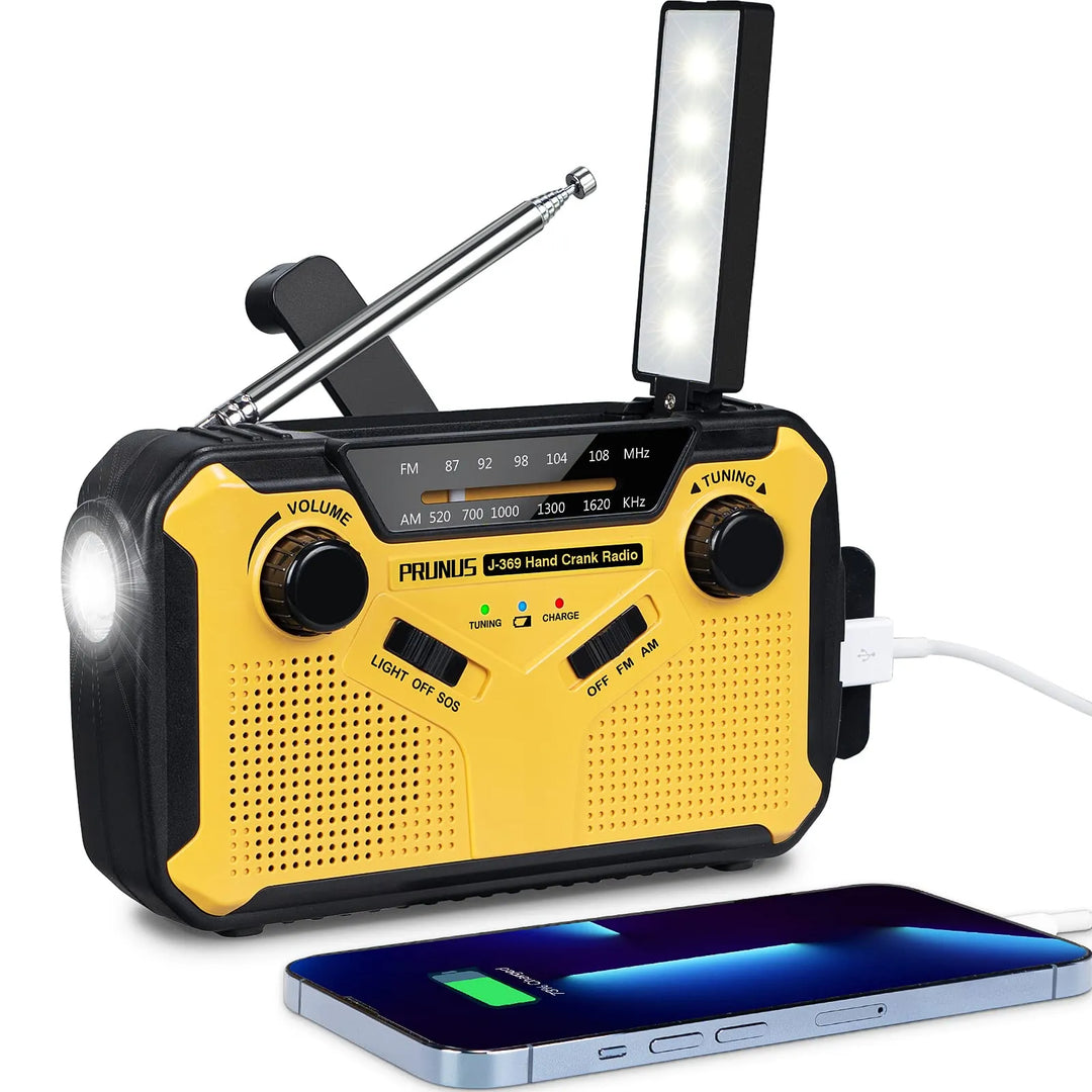 Portable emergency radio with hand crank and solar charger for survival gear and outdoor safety