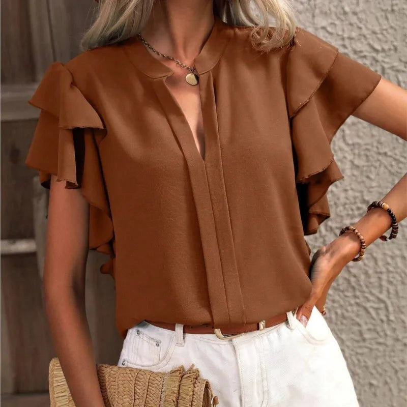 Elegant women's ruffle sleeve blouse viewed from the back