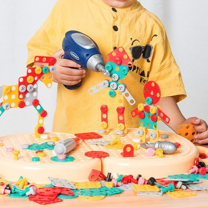 Child playing with kids Montessori construction toy toolbox building set