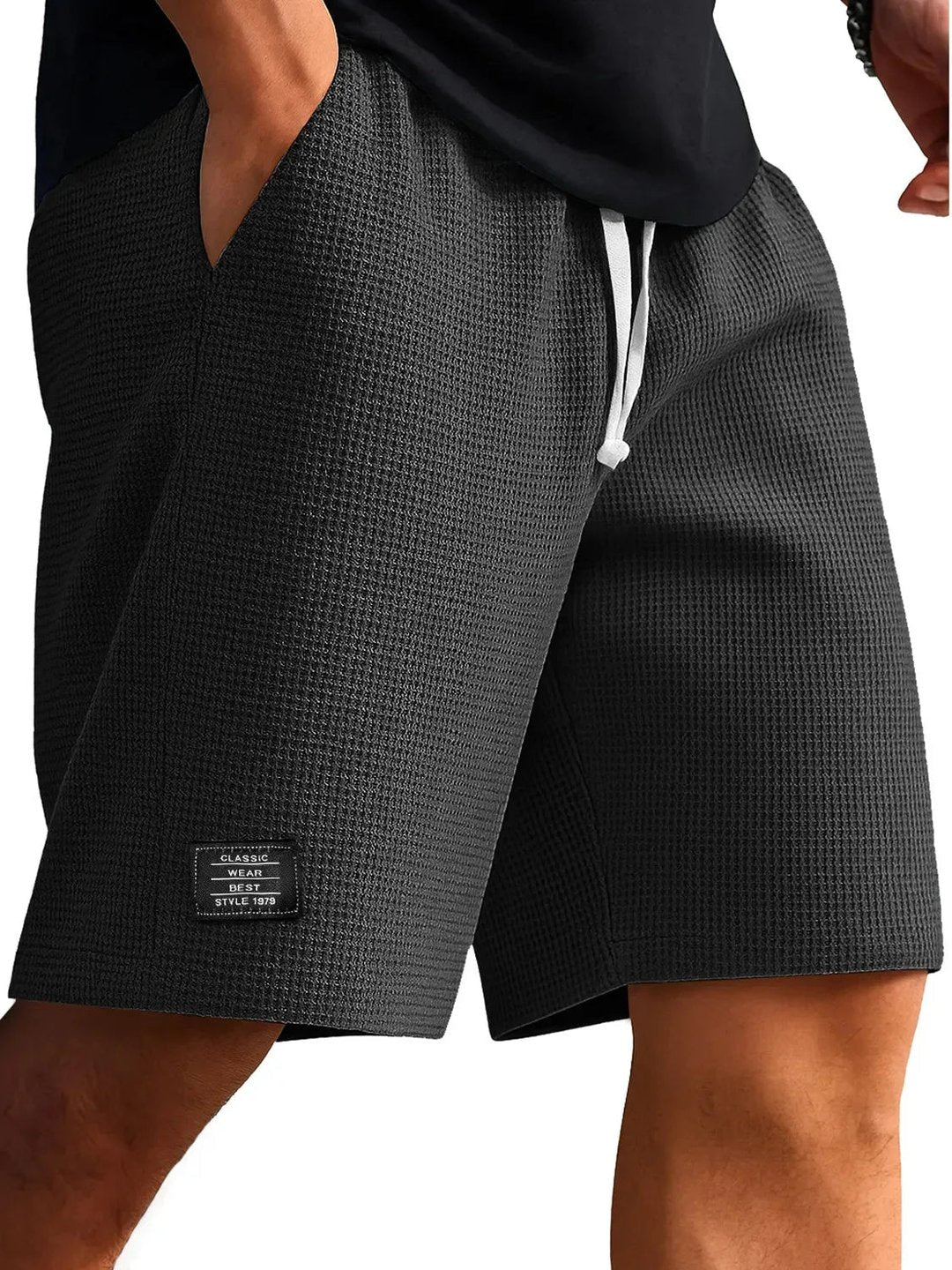 Men's dark grey lightweight summer shorts close-up