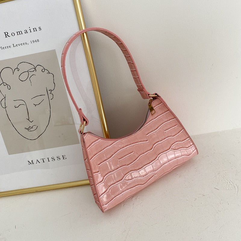 Side angle of animal print women's bag showing sleek silhouette and design