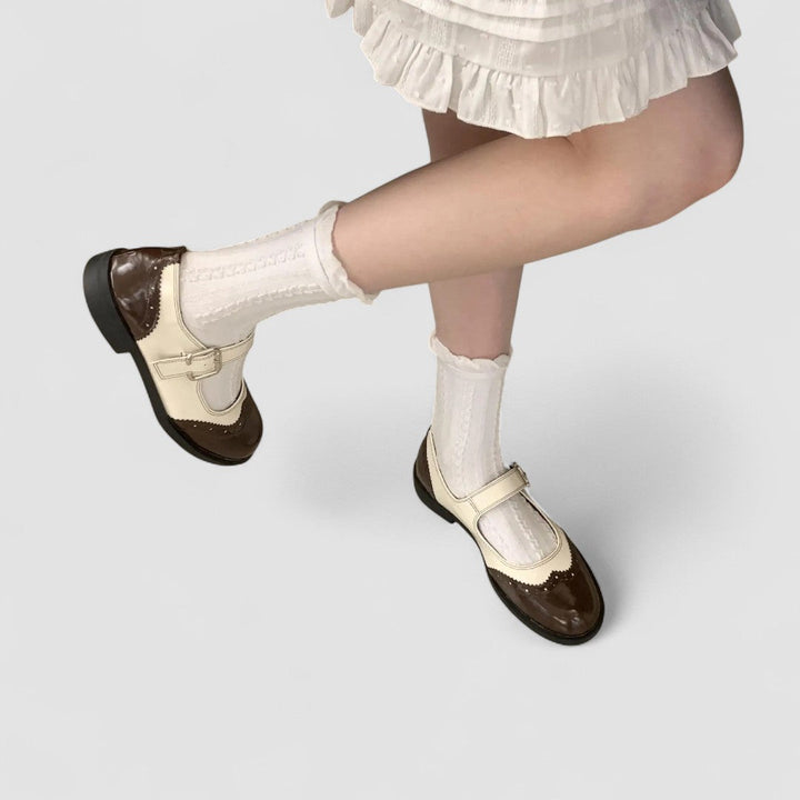 Comfortable casual footwear for women with a secure instep strap and classic silhouette.