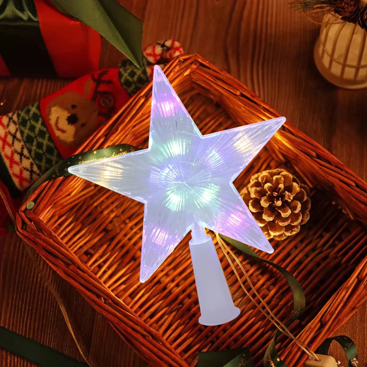Close-up of lighted LED star tree topper with intricate geometric design for holidays