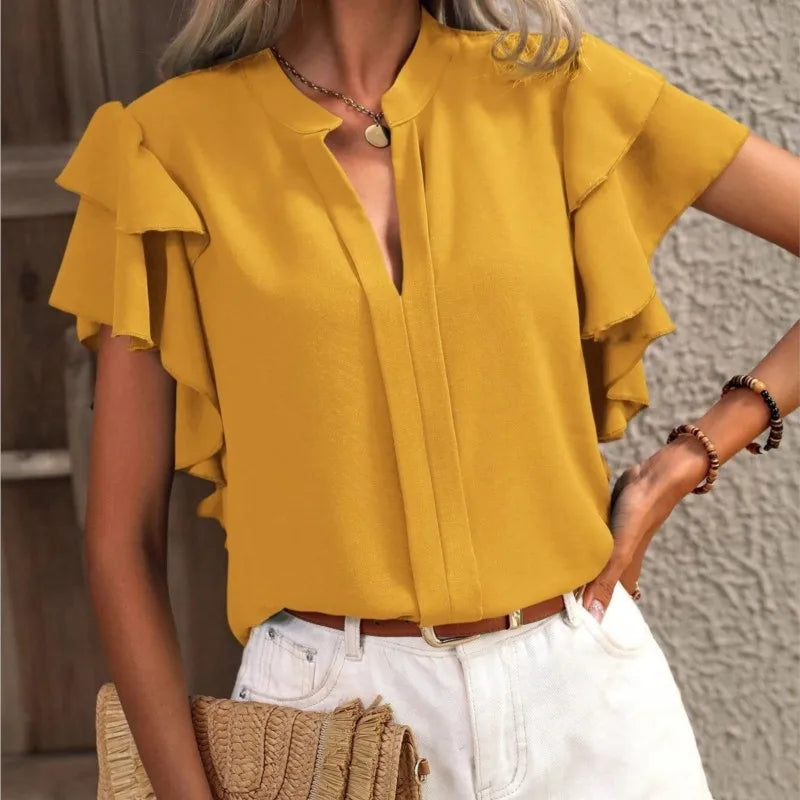 Woman wearing mustard yellow stylish blouse paired with trousers