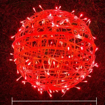 Woven rattan decorative sphere lights glowing brightly in a dark room