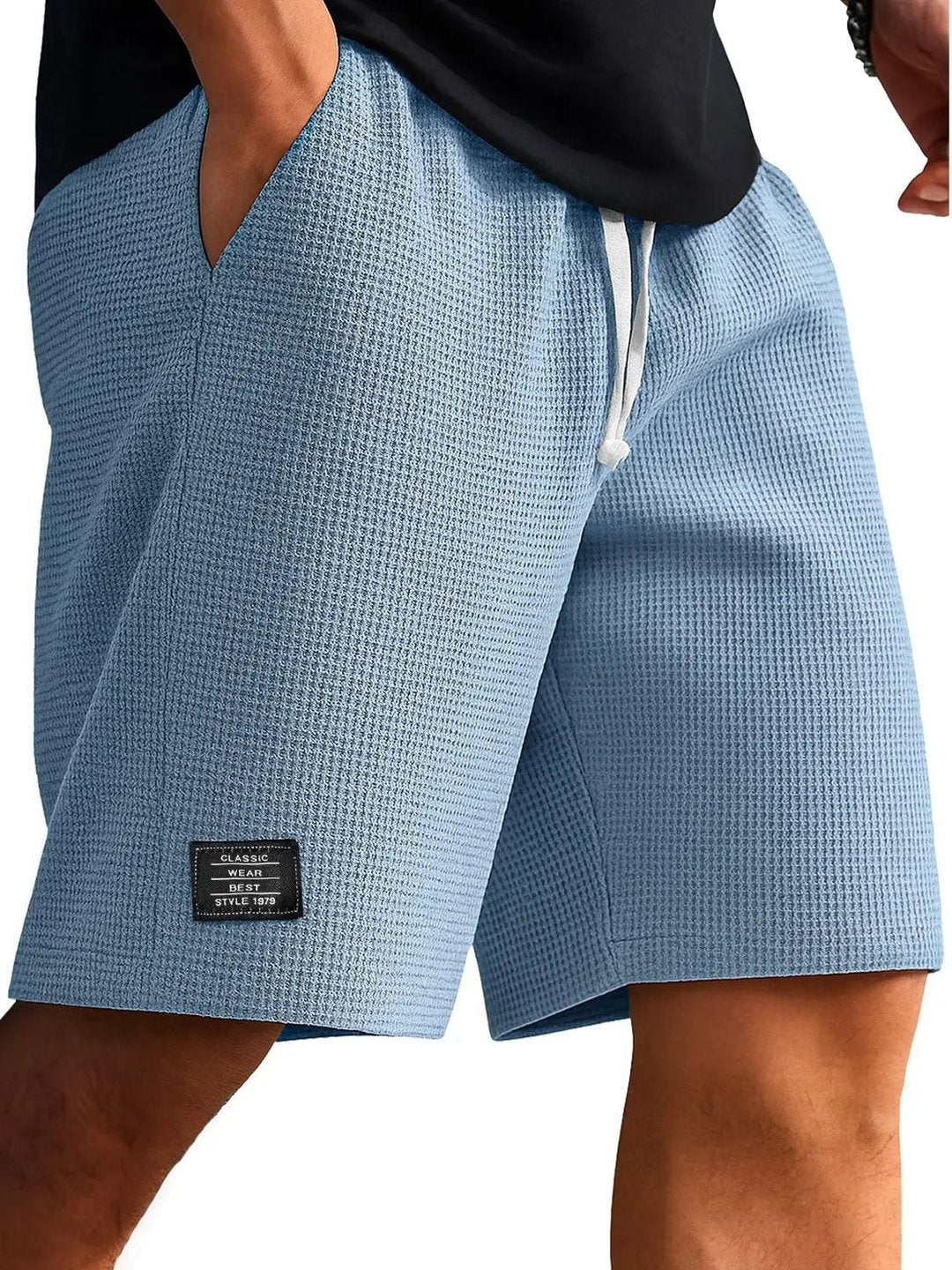 Men's light blue casual summer shorts featuring textured fabric
