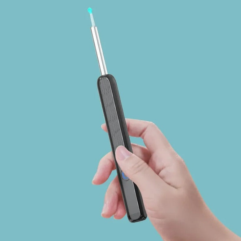 Compact USB rechargeable ear wax removal device with interchangeable tips