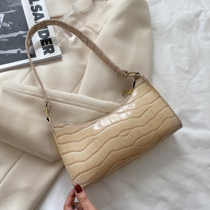 Minimalist design women's shoulder bag featuring clean lines and subtle logo