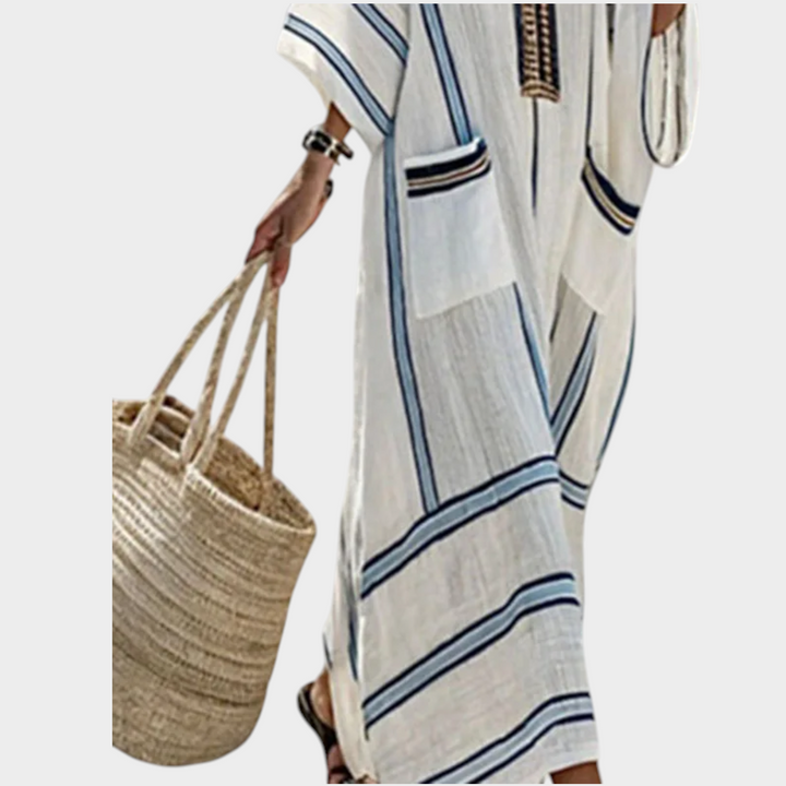 Back view of a casual striped maxi dress featuring a V-neck design for summer beach wear