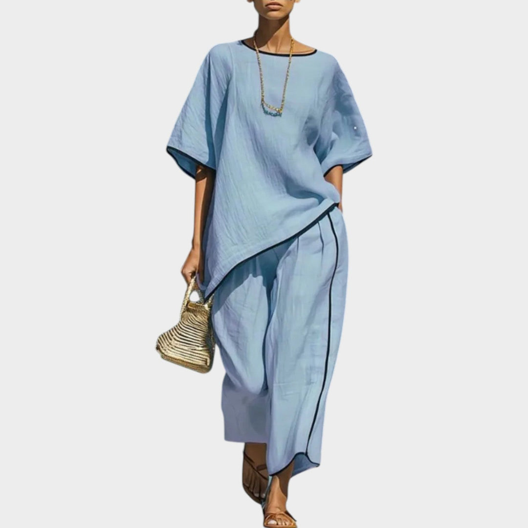 Model wearing sky blue matching set with oversized top and wide leg pants