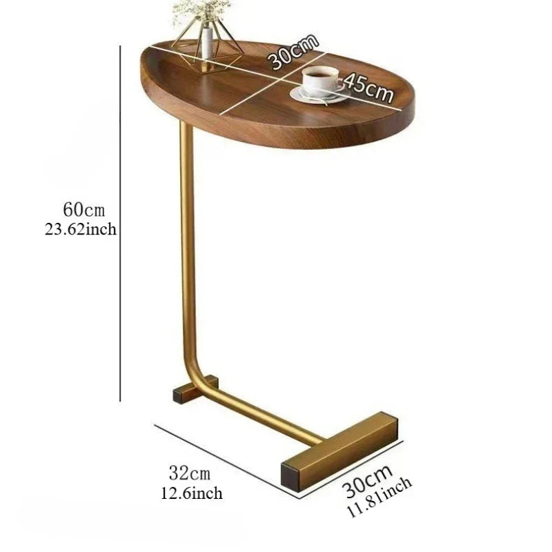 Small space bedside table with rolling casters positioned next to a modern bed