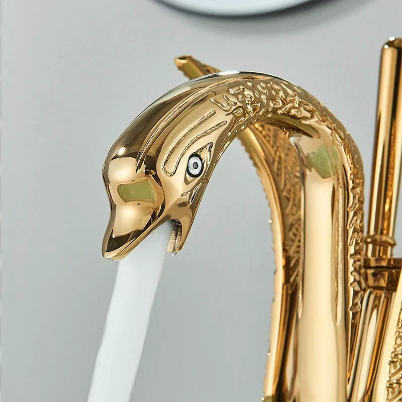 Detailed shot of a gold swan tap head showing exquisite detailing