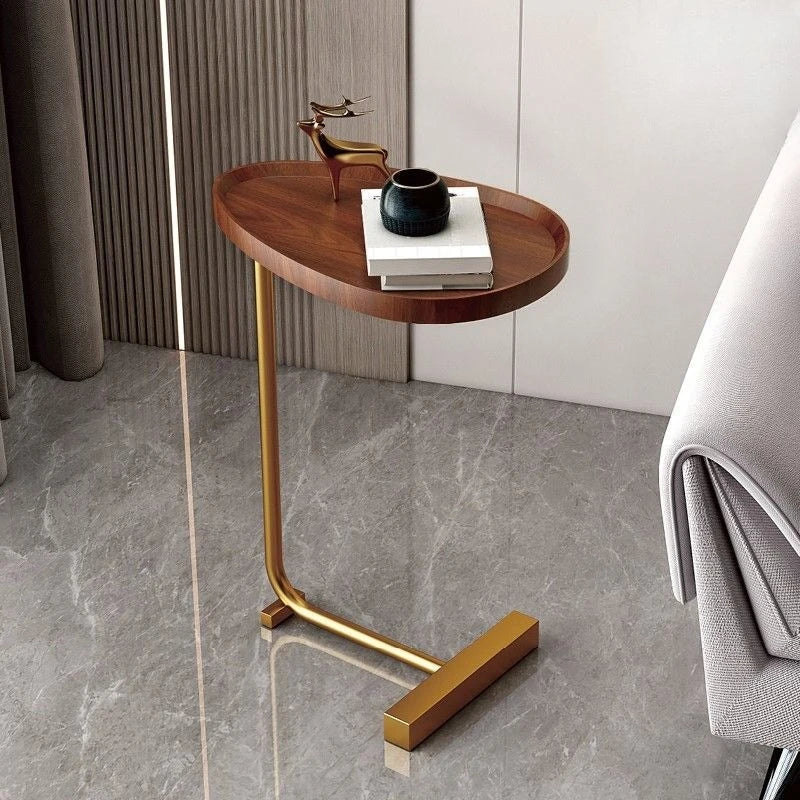 Angle view of the Nirethia C-shaped mobile side table displaying its functional shape and elegant surface