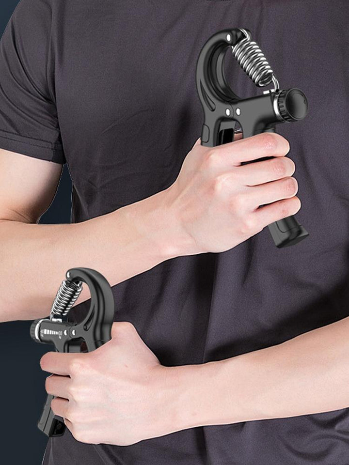 Person demonstrating exercise with a black hand grip strengthener
