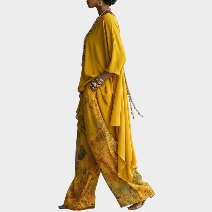 Side profile view of the yellow flowing tunic and matching patterned wide leg pants