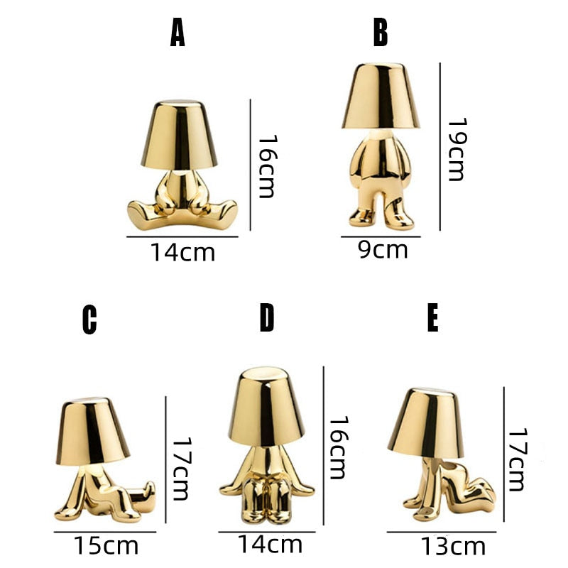 Pair of modern wireless table lamps in gold and silver set against a neutral wall
