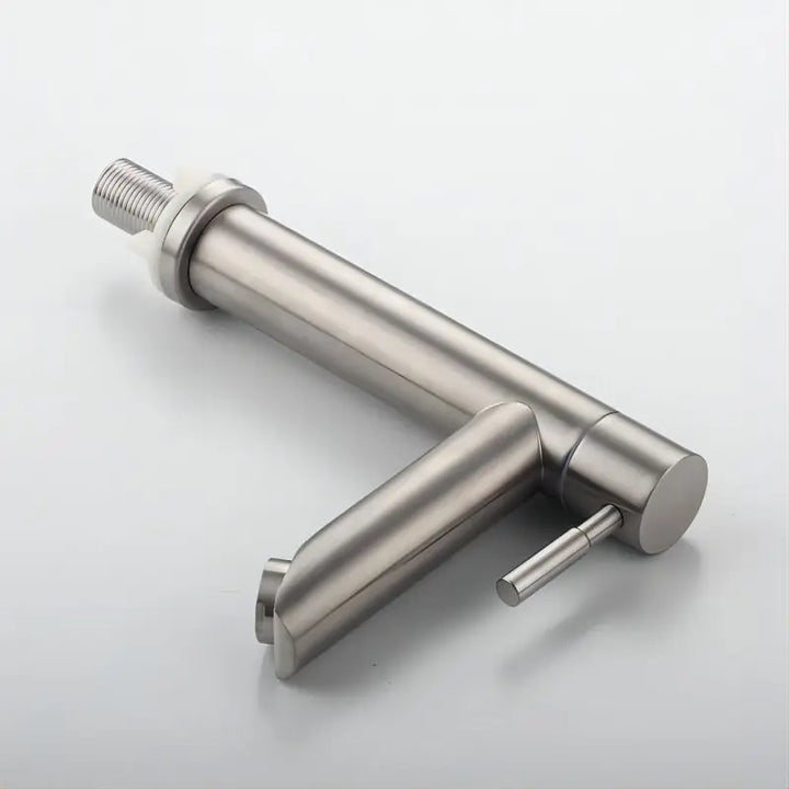 Brushed stainless steel basin faucet isolated on a white background