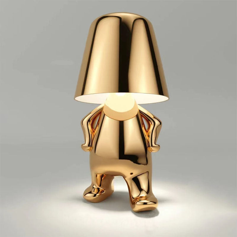 Gold designer accent lamp in standing pose