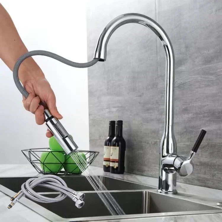 PureFlow chrome kitchen tap with pull-out sprayer in action over sink