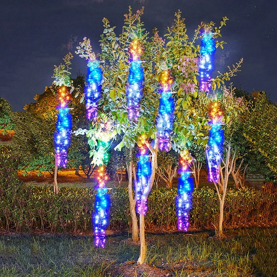 Cometfall multicolor LED string lights glowing vibrantly outdoors