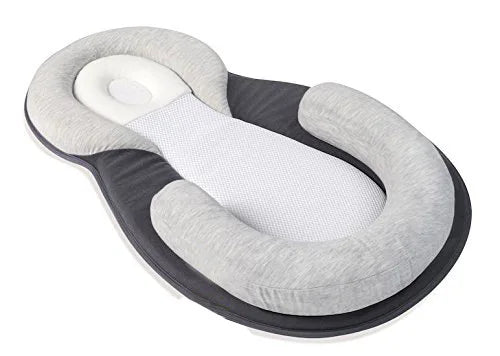 Versatile nursing pillow and baby sleep aid positioned for daily feeding time