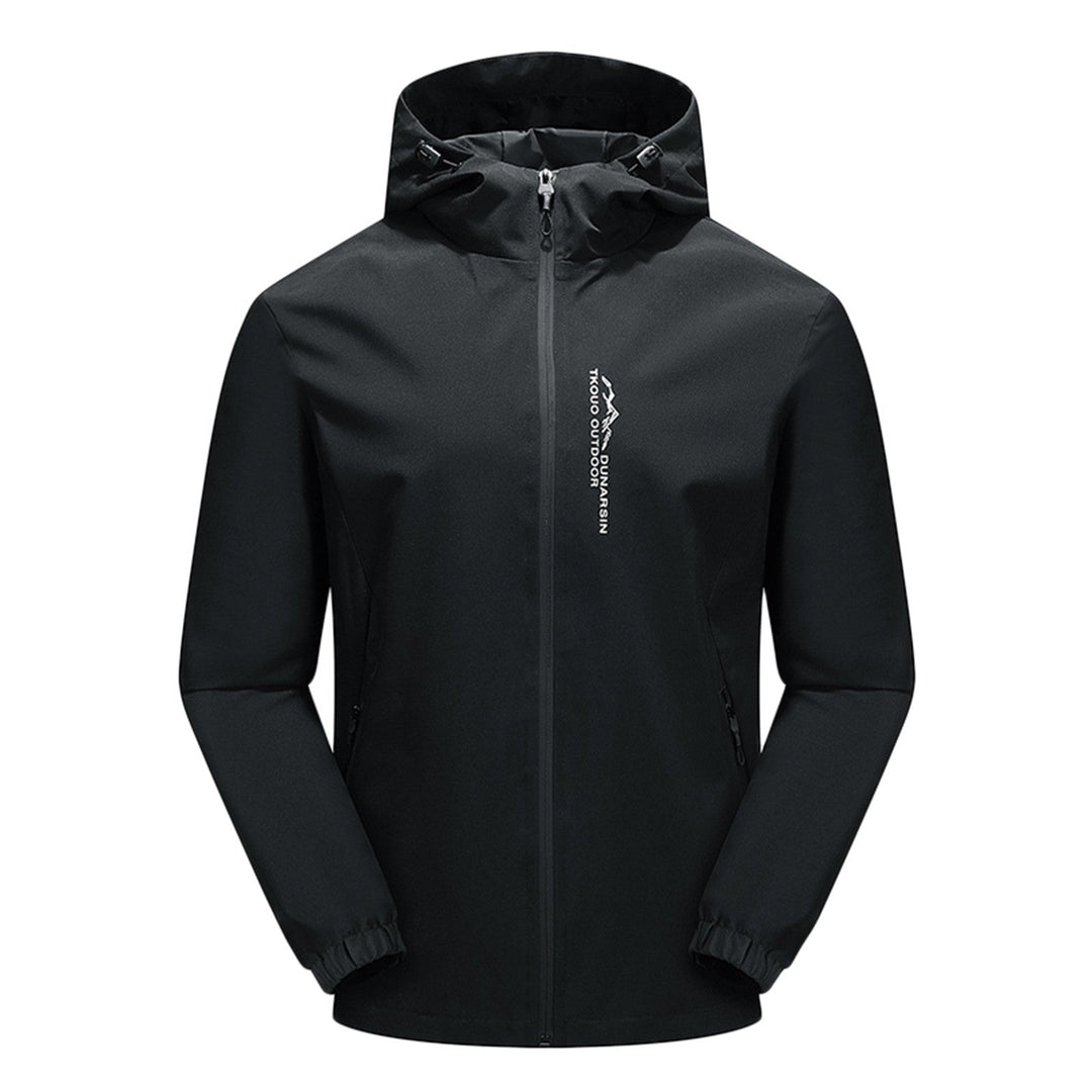 Women's windproof hooded outdoor jacket in action during a hike