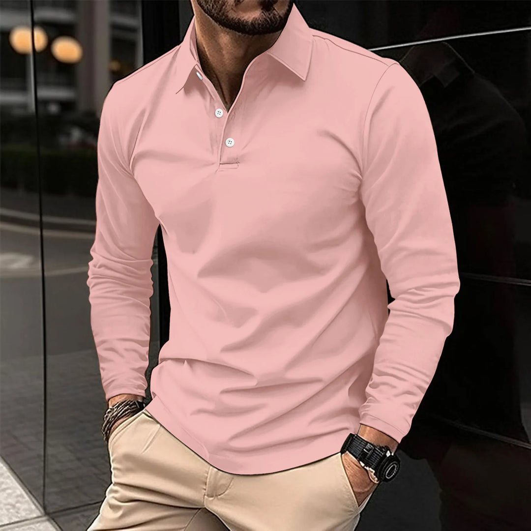 Man wearing pink long-sleeved polo shirt with khaki trousers