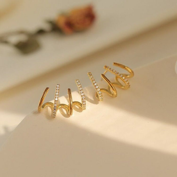 Close-up view of the four-in-one crystal-accented ear climber design