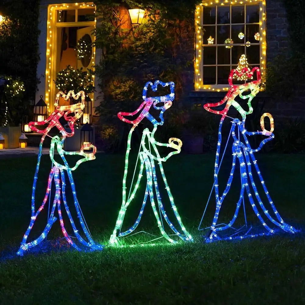 LED Three Wise Men Christmas light silhouette displayed on a front lawn at night