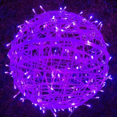 Ambient bedroom lighting with glowing wicker ball string lights on headboard