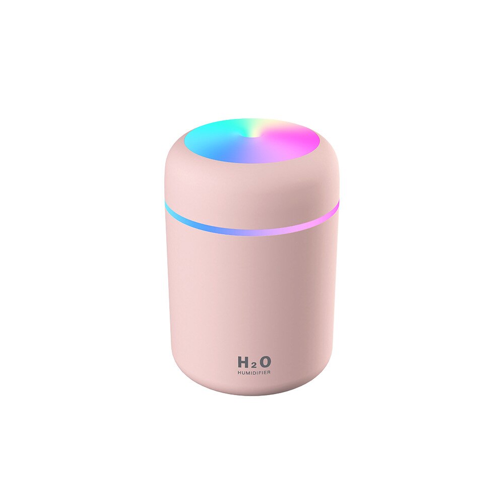 Air diffuser and humidifier operating in a dimly lit bedroom
